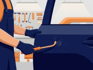 Vakkundige handen die een kleine deuk in een autoportier repareren in een professionele carrosserieworkplaats.